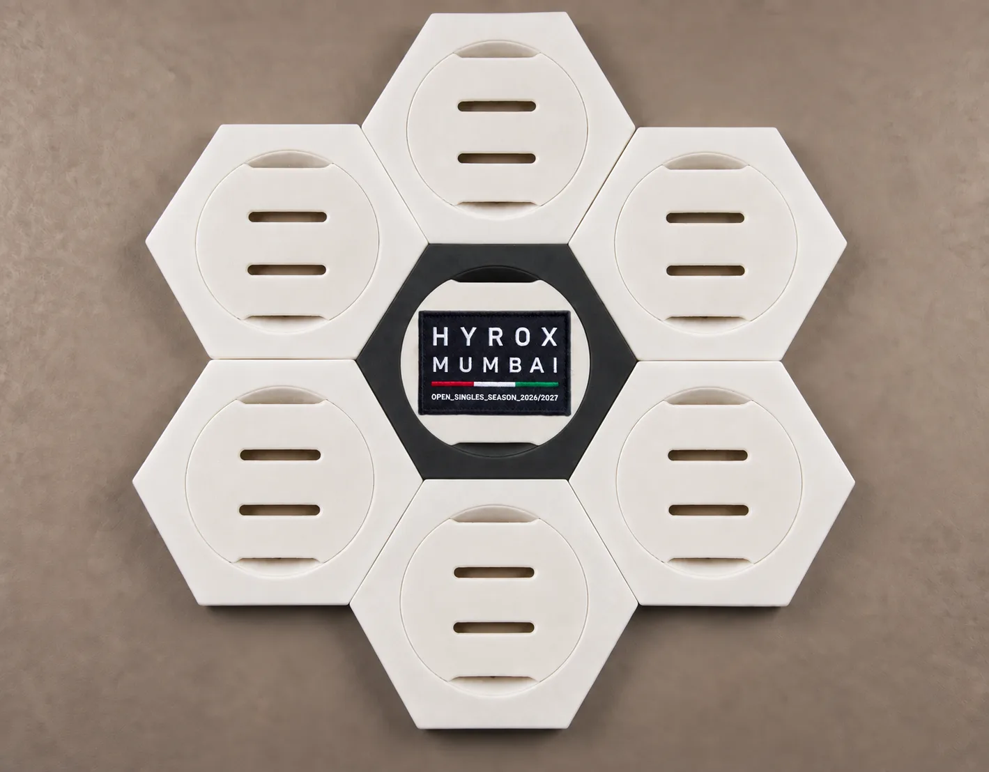 Six empty white Medal Frames around a black centre Patch Frame showing a HYROX Mumbai race patch.